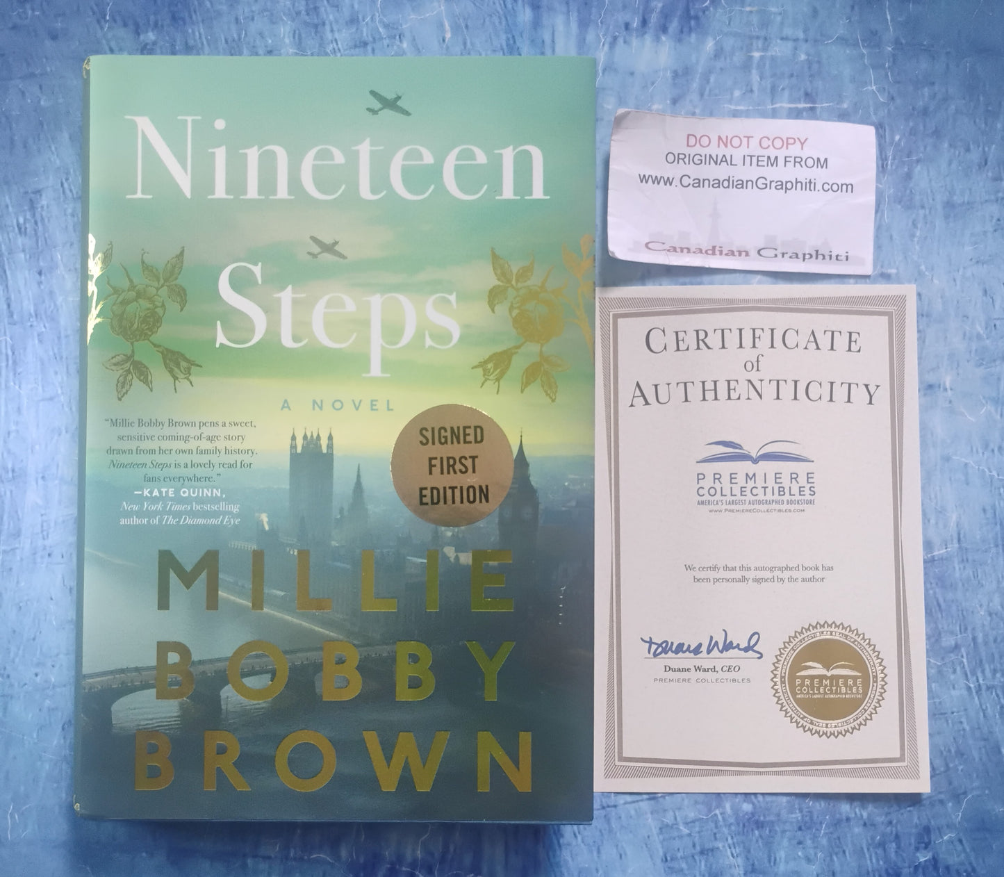 Millie Bobby Brown Hand Signed Autograph Nineteen Steps Book COA